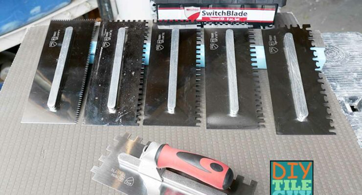 a kit of different sized notch trowels with one interchangeable handle