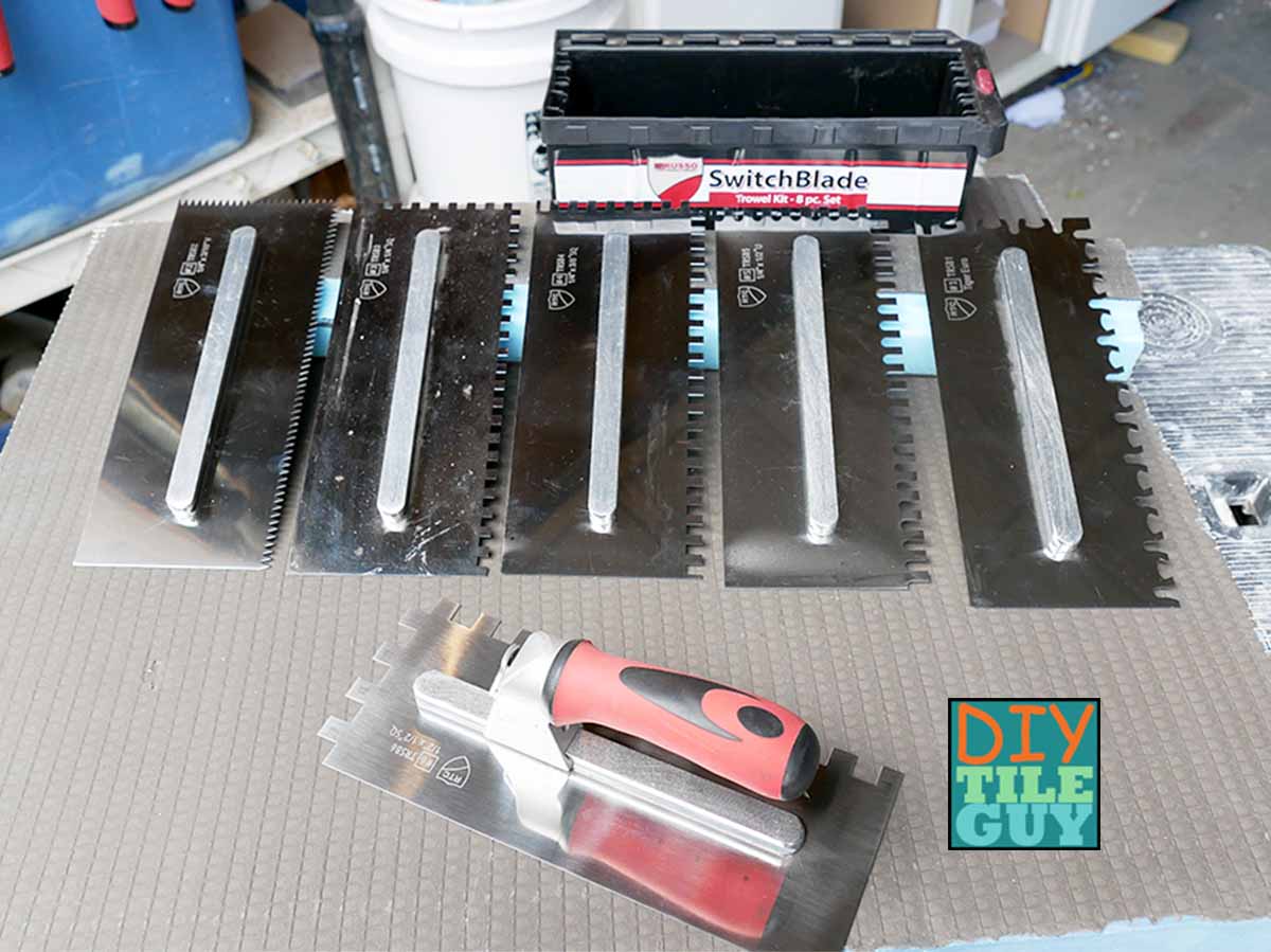 RTC SwitchBlade notch trowel kit. Comes with 6 different trowel blades, a removeable handle, and a plastic storage box with drainage holes at the bottom